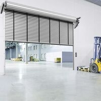 Teckentrup XXL double roller shutter on large blue hall, wide grey exit in front of it, truck inside the hall