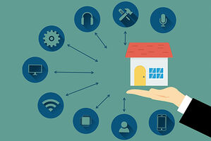 Haus auf einer Hand - drumherum zu sehen Smart Home Anwendungen im Grafikstil